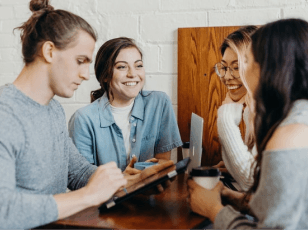 People sitting close and smiling